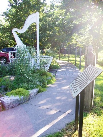 13' Wind Harp designed by artist Ron Konzak & played by a 15 mph wind that produces sound by vibrating the tuned metal harp strings. Located at Blind Boone Park