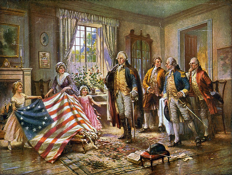 This image depicts what is presumed to be Betsy Ross and two children presenting the "Betsy Ross flag" to George Washington. The image is a version of a painting entitled "The Birth of Old Glory" by Percy Moran cir 1917 (Library of Congress)
