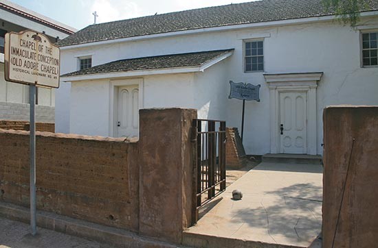 Adobe Chapel with historical marker out front.