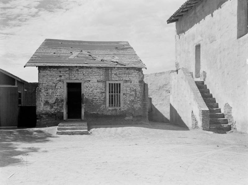 The quarters of the Mission's friars in 1938, partway through the Mission's complete restoration (LA Public Library).