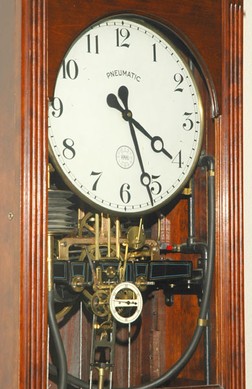 A close view of one of the building's pneumatic clocks