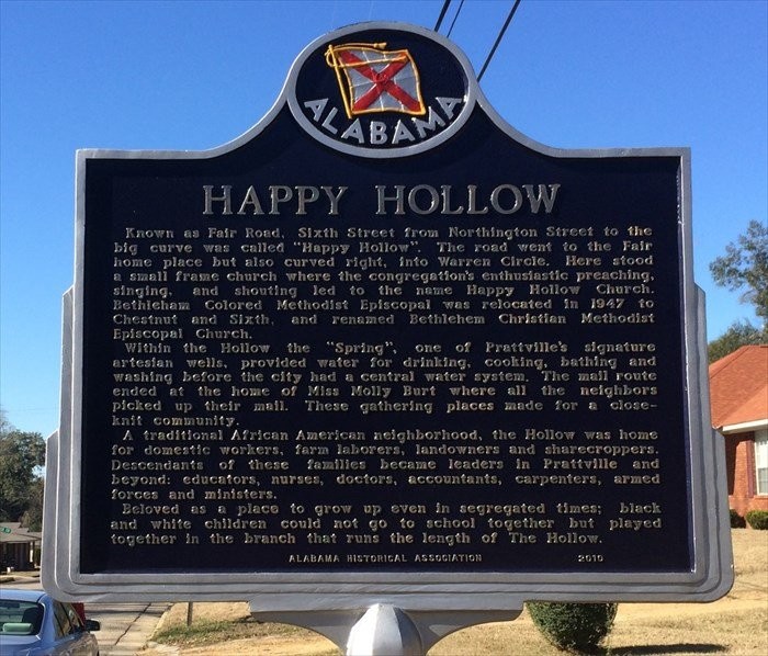 This historical marker describes Happy Hollow's history.