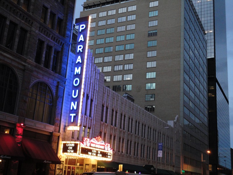 The Paramount Theatre's neon sign at nightfall. Photo by Paul Sableman. Licensed under Creative Commons.