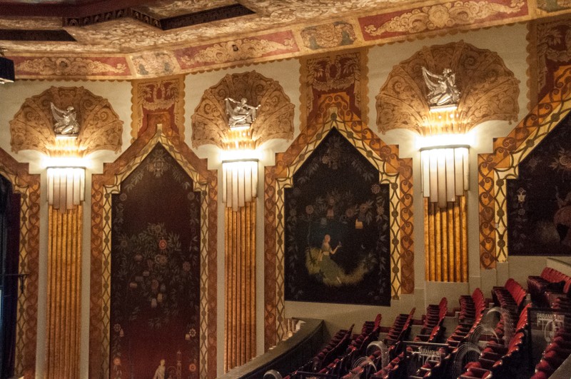 The Paramount theater's Art Deco detailing and murals painted on silk seen from the balcony. Photo by Ken Kanouse. Licensed under Creative Commons.