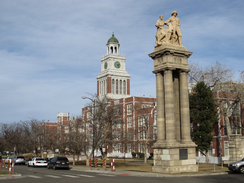 Figures representing Mining atop the eastern side of the Sullivan Gateway in front of East High. Photo by Ken Lund. Licensed under Creative Commons.