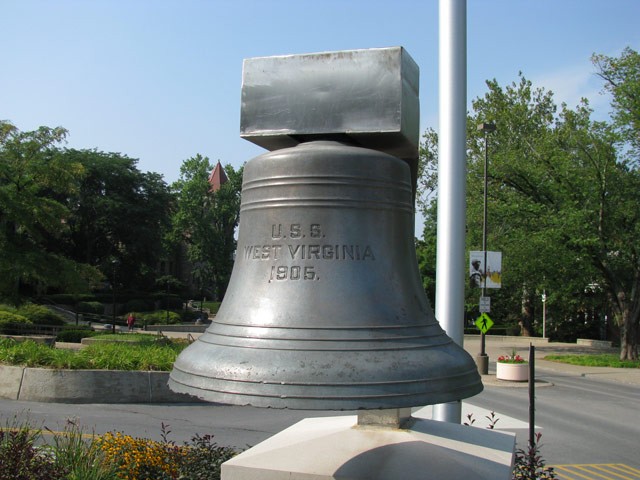 The bell of the armored cruiser U.S.S West Virginia later installed next to the mast.