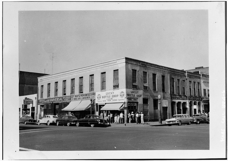 The building sunk further into neflect in the 1950s. By 1960, only the Lucky Bottle Shop would remain (Library of Congress).