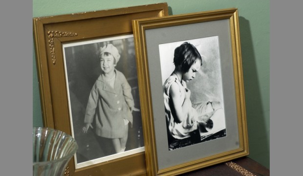 Mary Flannery at ages 3 and 4 years old, respectively. These photographs sit on one of the mantles.