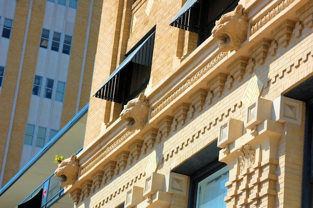 Close-up of Panther heads that adorn the building.