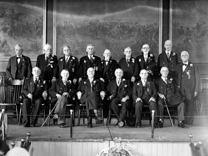 GAR members in 1932 in the auditorium. Notice the murals on the wall depicting Civil War battles.