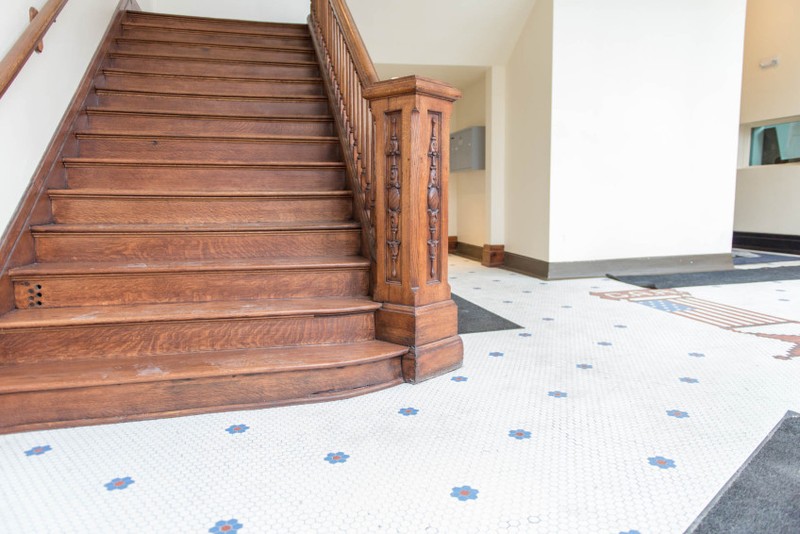 The stairwell during renovation. Notice the tiled floor with the GAR emblem