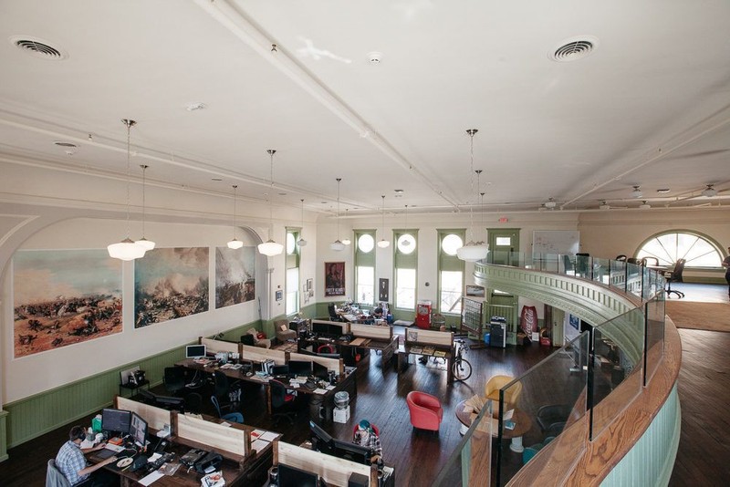 The auditorium is now used as Mindfield's work space. Notice the battle murals placed in the same location as the originals in a previous photo.