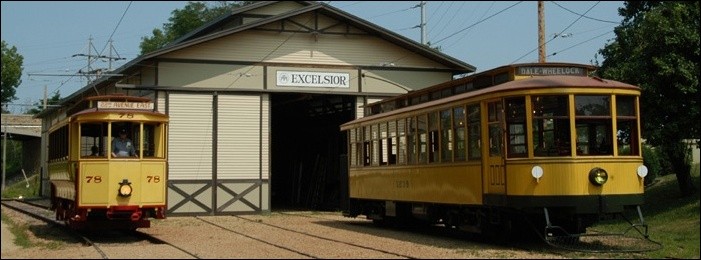 Two of the museum's streetcars sit outside the shed at the Excelsior stop.