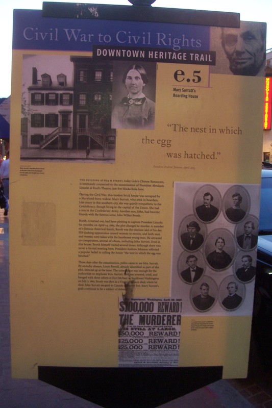 Surratt Boarding House marker on a sidewalk pole in front.  Note the gallery of conspirators tried for Lincoln's murder. Photo By Richard E. Miller on HMdb.org (reproduced under Fair Use)