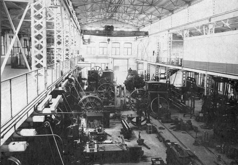 Interior of Phoenix Manufacturing machine shed, showing log train locomotives (ca. 1907-1925)