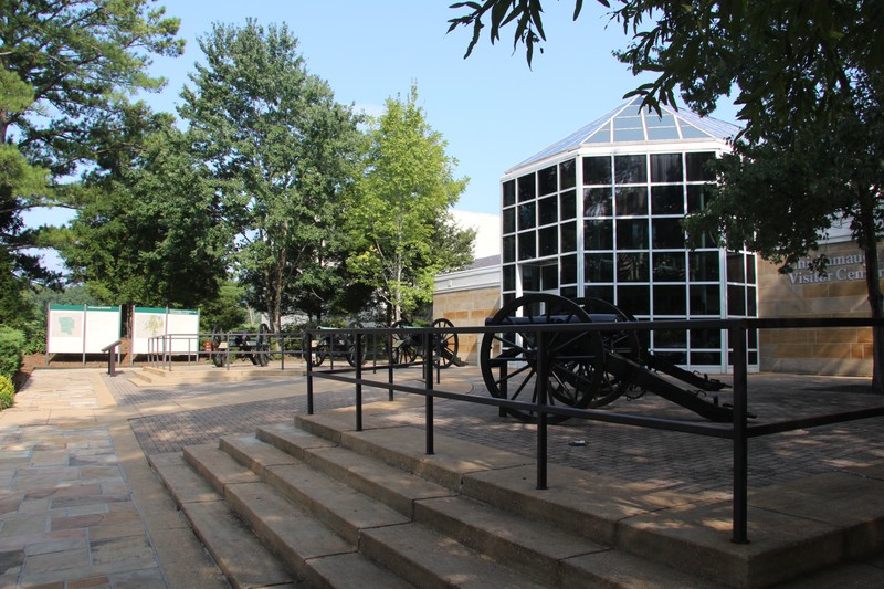 A distant view of the two panel markers situated just to the left of the Visitor Center's main entrance. (Photo by Dale Benington)