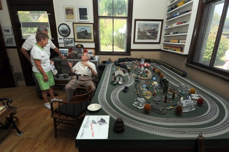 Mr. Compton Showing a model of the train tracks