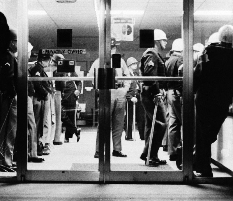 Officers blocking students from entering the bowling alley.