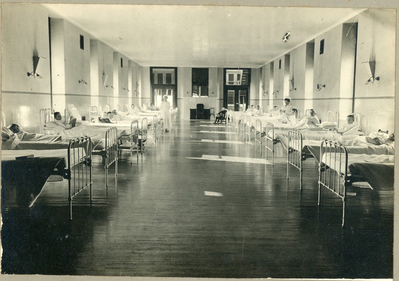 Students in beds inside Infirmary ward.