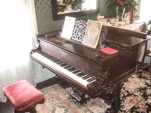 The 1877 Steinway is in the restored music studio in the home