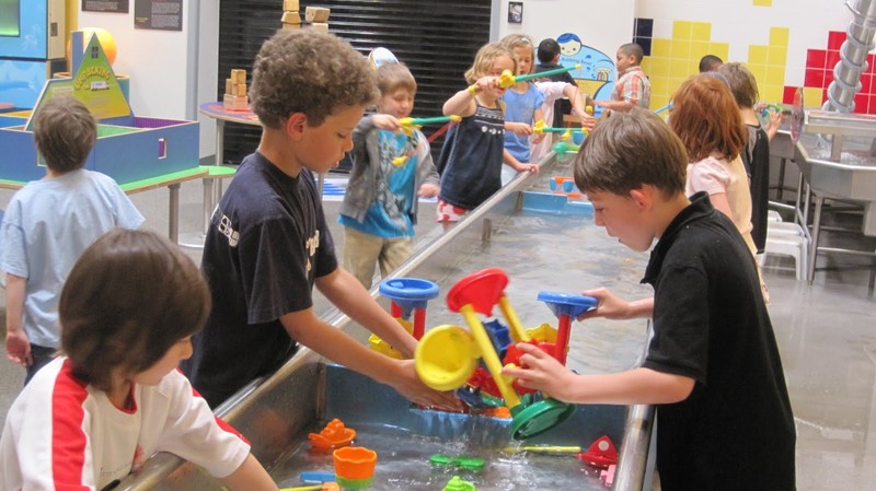 Children love to play in the water tables at the Water Gallery