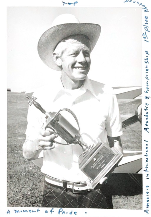 Dr. Charles Carothers holding the first place trophy of The Americas International Aerobatic Championship