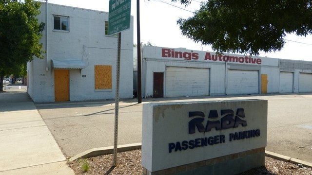 Bell Rooms Building (on left) c. 2016, as it stood awaiting demolition before it was purchased by the McConnell Foundation for preservation and restoration as a bike shop and cafe