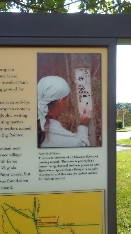 3.This is a re-creation of a Delaware (Lenape) hunting record. The actor is portraying a hunter using charcoal and bear grease as paint. Bark was stripped from a living tree to paint this record, and this was the typical method for making records. 