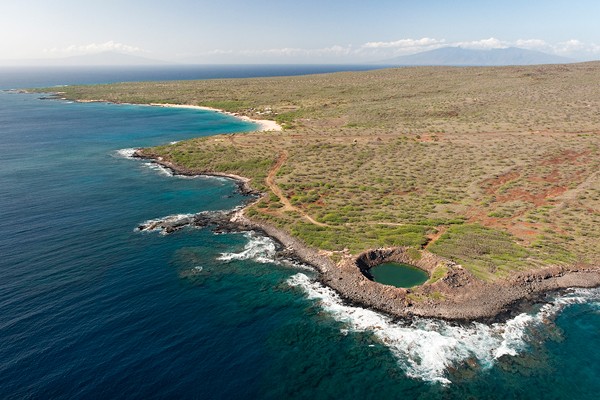 Aerial view of the island. The small round feature on the bottom is actually a crater left from an exploding bomb.