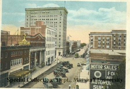 Circa 1915 postcard of 4th Avenue looking west, with the white Day and Night Bank visible on the left. Courtesy of Marshall University Special Collections.