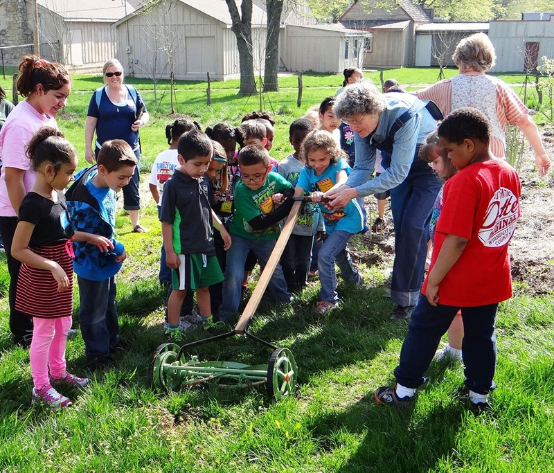 A school group learns about life on the farm