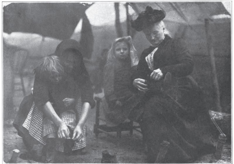 Mother Jones (far right) assisting miners' children.  Jones was a prominent union organizer of her day, and a key figure in the strikes that led to the Mine Wars.