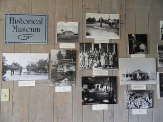 Photos of early settlers and farmers displayed in the museum.