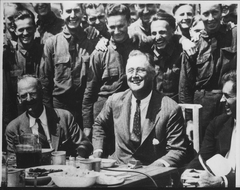 Fechner (bottom left) with Franklin Roosevelt (front center) during a visit to a CCC camp, ca. 1933 - 1939