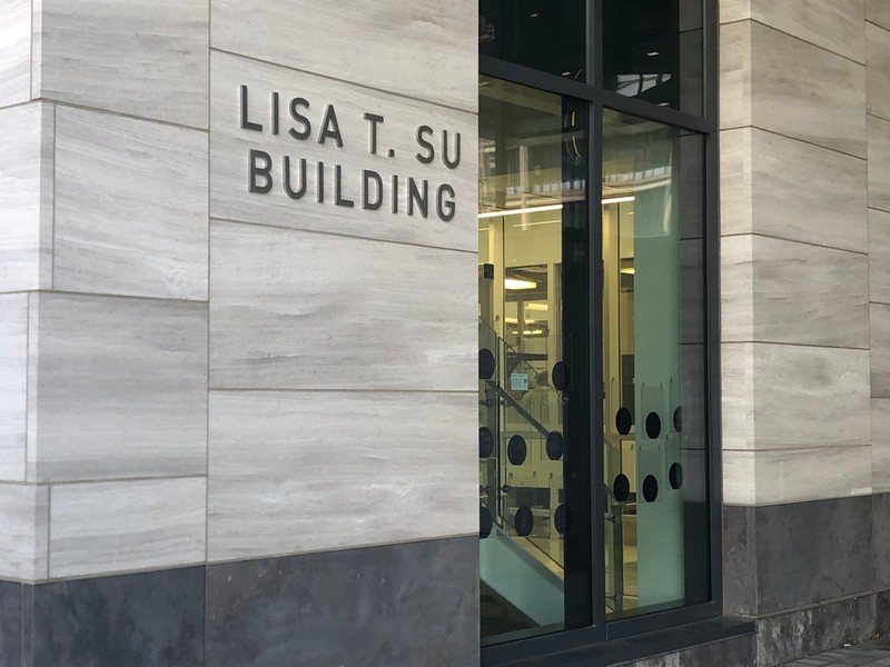 Gray stone & glass building facade, Lisa T. Su spelled in large silver block letters 