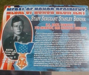 Picture of plaque describing Staff Sergeant Stanley Bender's actions at La Ladone, France in August 1944 earning him the Medal of Honor.