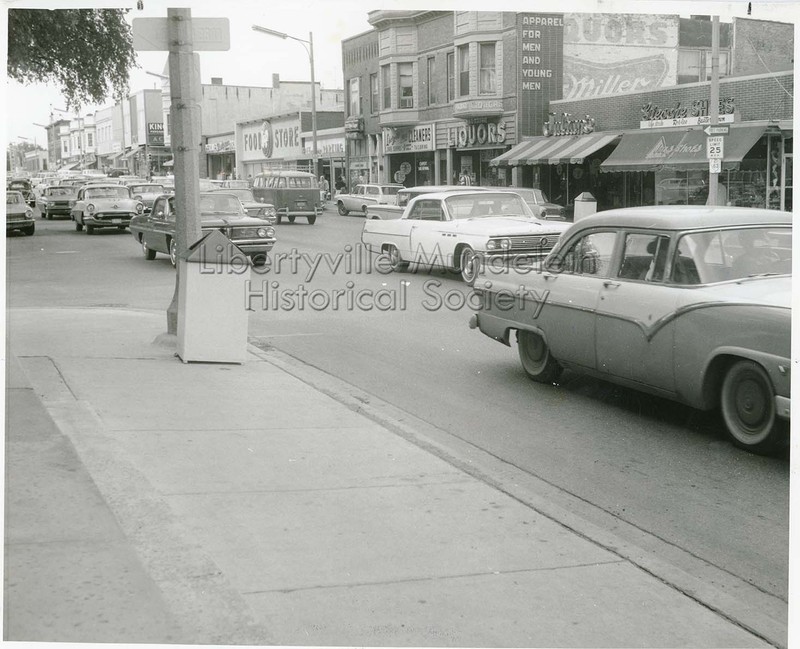 Street view looking north on Milwaukee Ave. Visible are the Kaiser Building with two second story bay windows, the Hanby Building, and the A&P Food Store.