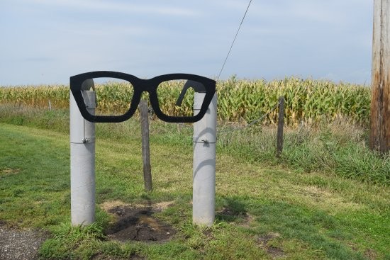 A stainless steel guitar, glasses, and records marks the spot where the plane crashed. 