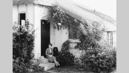 The Marjory Stoneman Douglas House was built in 1926. It features a masonry vernacular appearance with elements of Tudor and Medieval Revival styles.