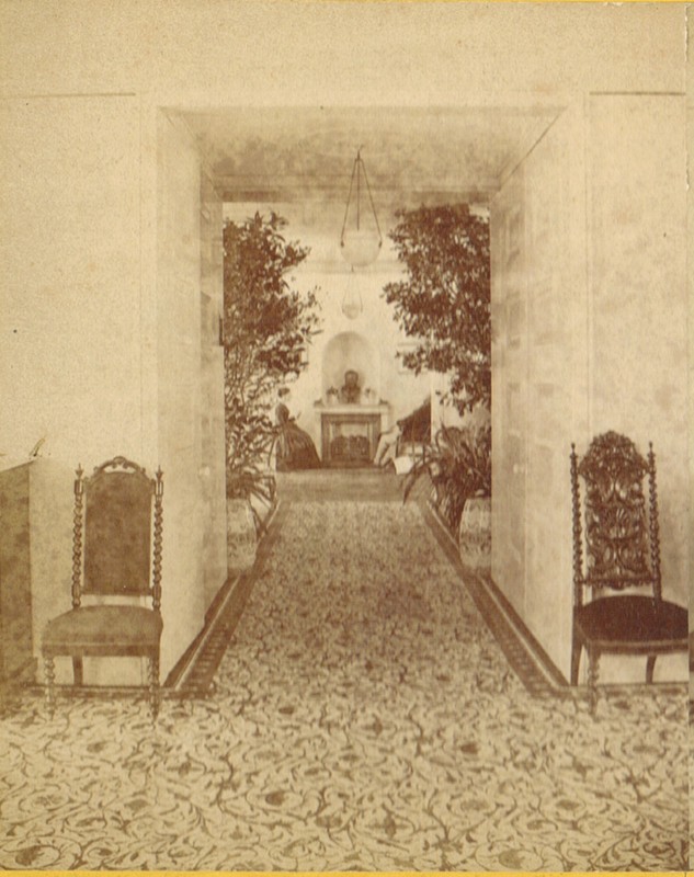 A late 19th century view of the interior, back parlor from the conservatory 