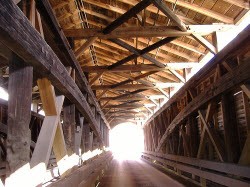 Interior view of the bridge with Burr arch trusses visible