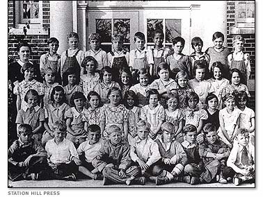 Malcolm's class photo. He is the only African American in the photo, back row, center.