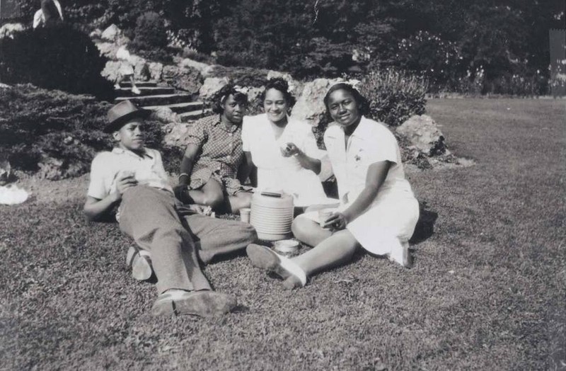 Malcolm, far left, shortly after his move away from Michigan