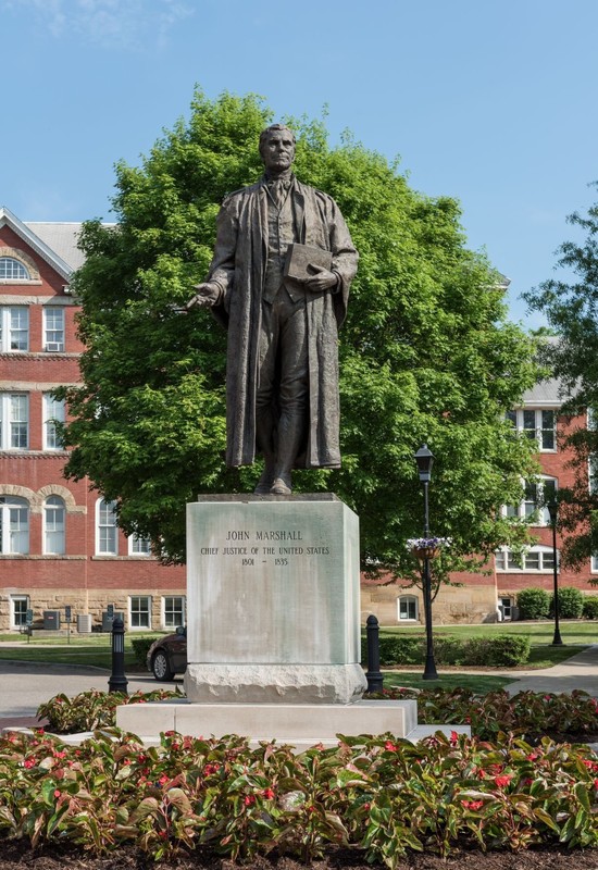 The base of the sculpture is engraved with the words "Revolutionary Soldier. Definer of the Constitution. Devoted husband and father." Image obtained from the Library of Congress. 
