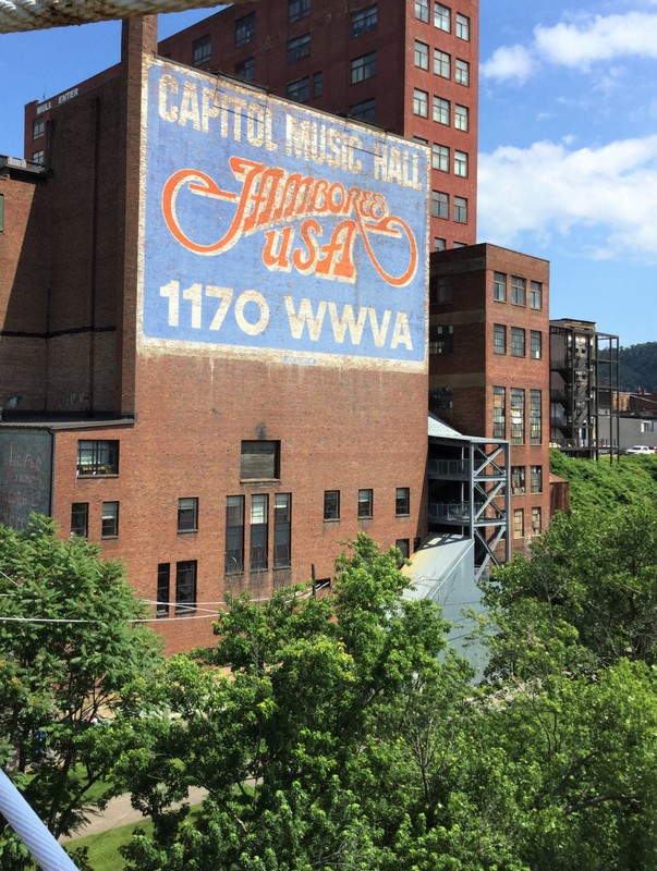 Visitors crossing the suspension bridge into Wheeling see this sign, a reference to the country music radio show first broadcast in 1933 on 1170 am. This 50,000 watt station that covered most of the country east of the Mississippi. 