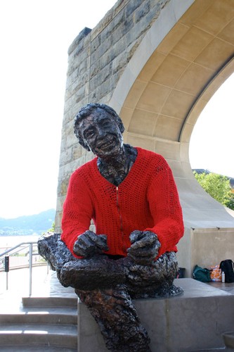 Mr. Rogers wearing his trademark sweater to keep the chill off.