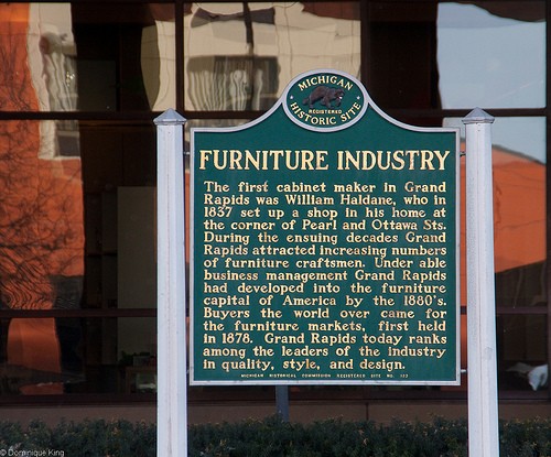 A historical marker in front of the Grand Rapids Public Museum at the corner of Pearl and Front Streets tells the story of the Furniture City