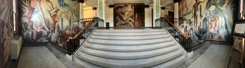 panoramic view of mural with viewer facing stairs across from mural