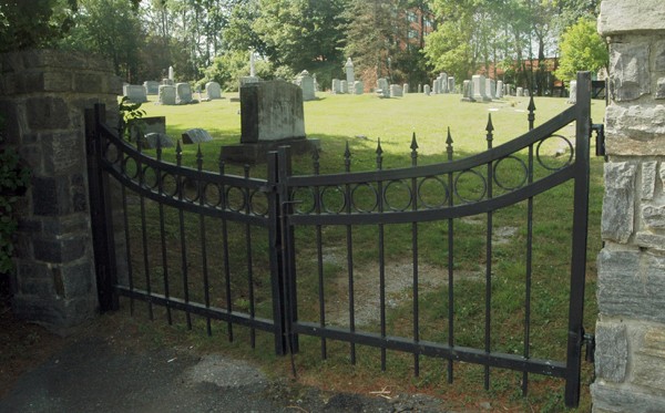 The main entrance gate to the white section of the cemetery off of Howard Street. 