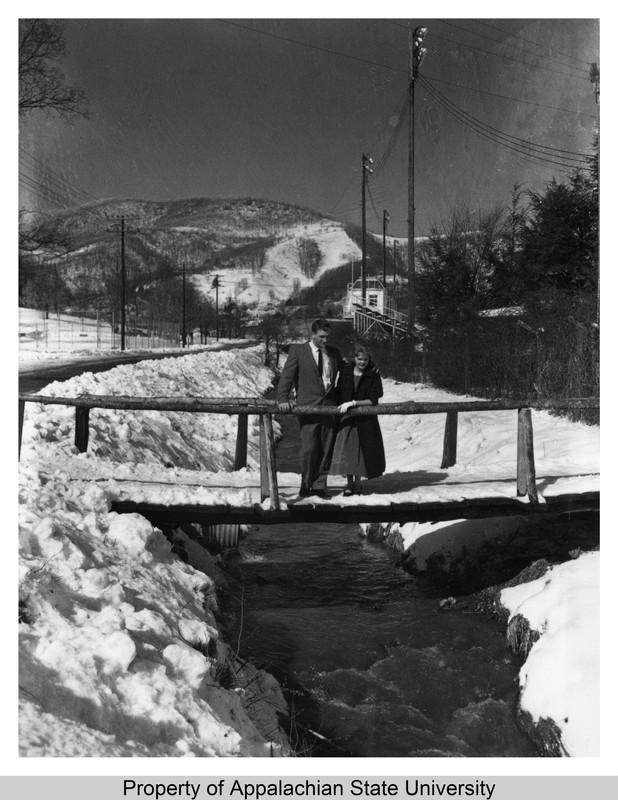 Two students stand on a snowy bridge over Kraut Creek in 1957.
“Jean Rankin by Kraut Creek, 1957, photo 1,” Appalachian State University Digital Collections, accessed December 6, 2016, http://omeka.library.appstate.edu/items/show/11212.